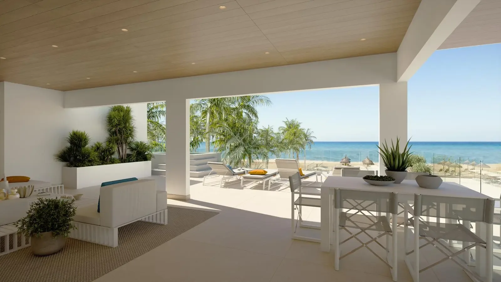 Terraza exterior con comedor y vista al mar en Ocean Paradise